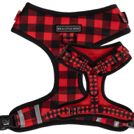 Adjustable dog harness with a plaid pattern in red and black, featuring reflective stripes, brand logos, and adjustable straps.