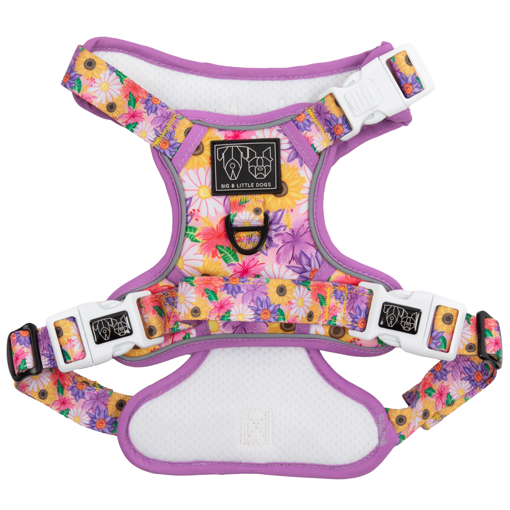 Adjustable dog harness with a floral pattern in pink, purple, and yellow colors, featuring white straps and a metal d-ring.