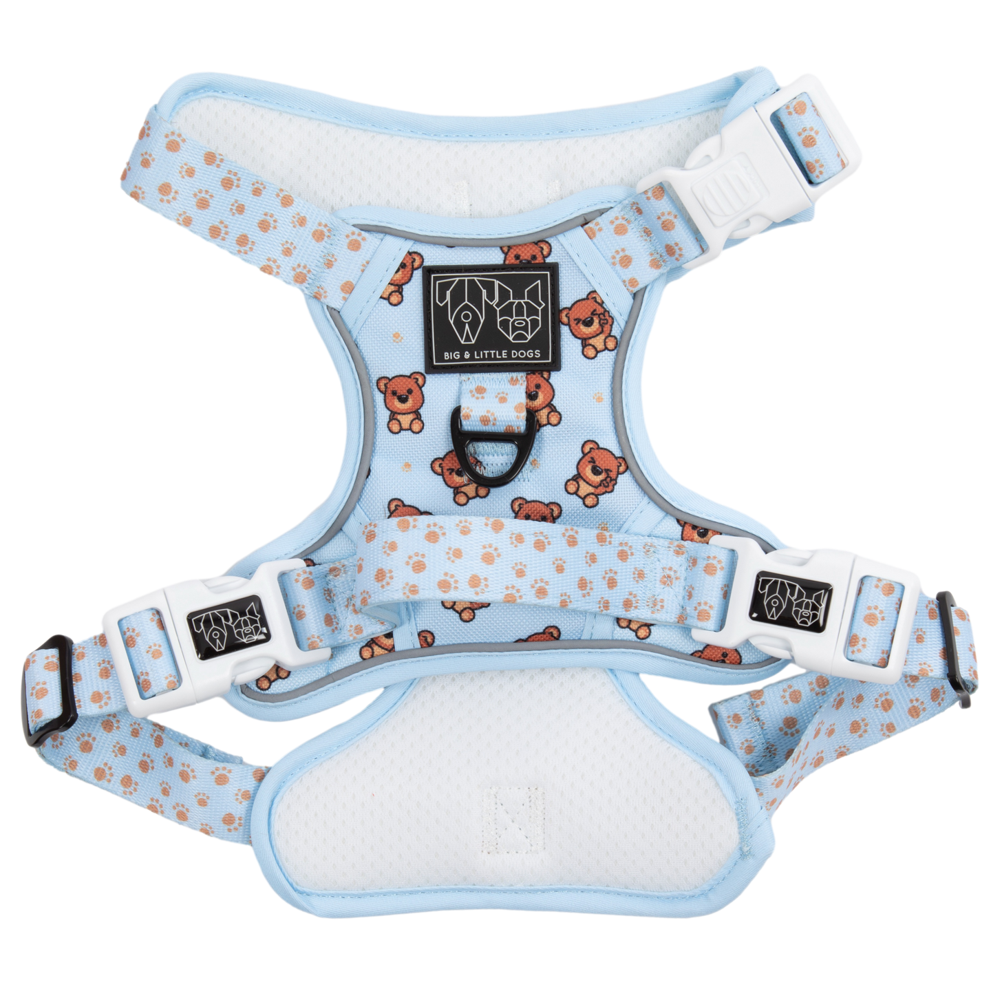 Adjustable blue dog harness with brown teddy bear design and white paw print accents, featuring metal buckles and a branded patch.